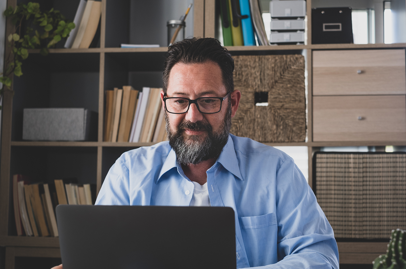 Confident professional on a laptop