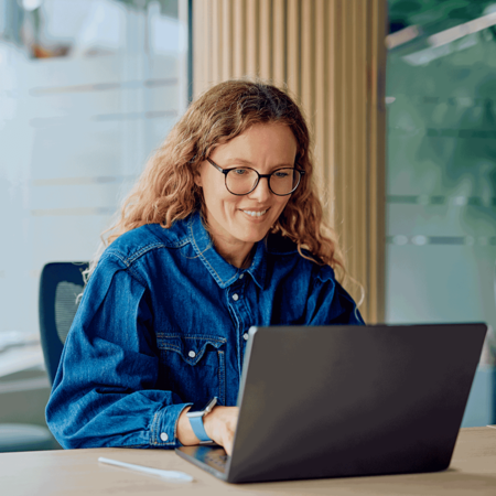 Woman reviewing a dashboard on her laptop
