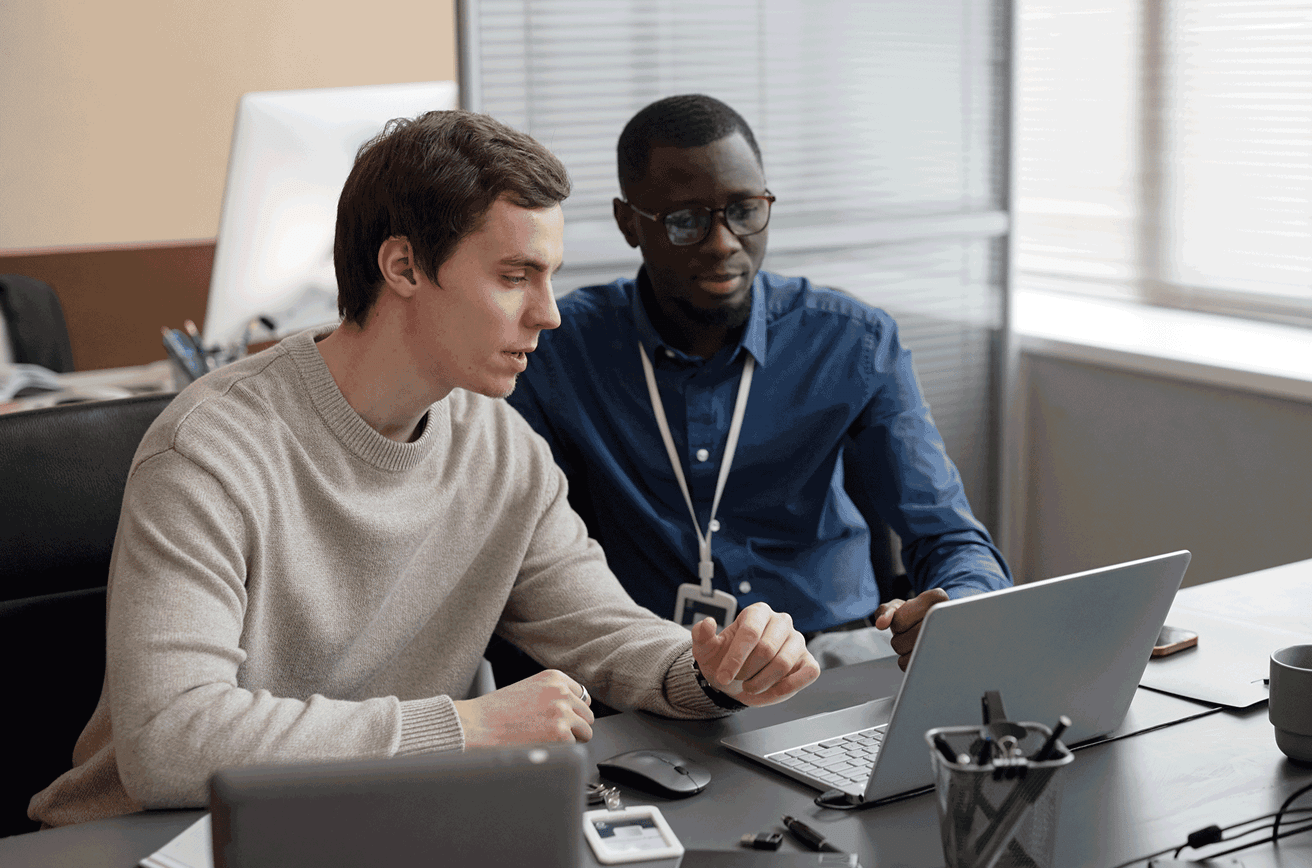Men reviewing information on a computer