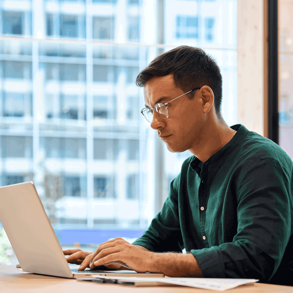 Man reviewing data on a laptop