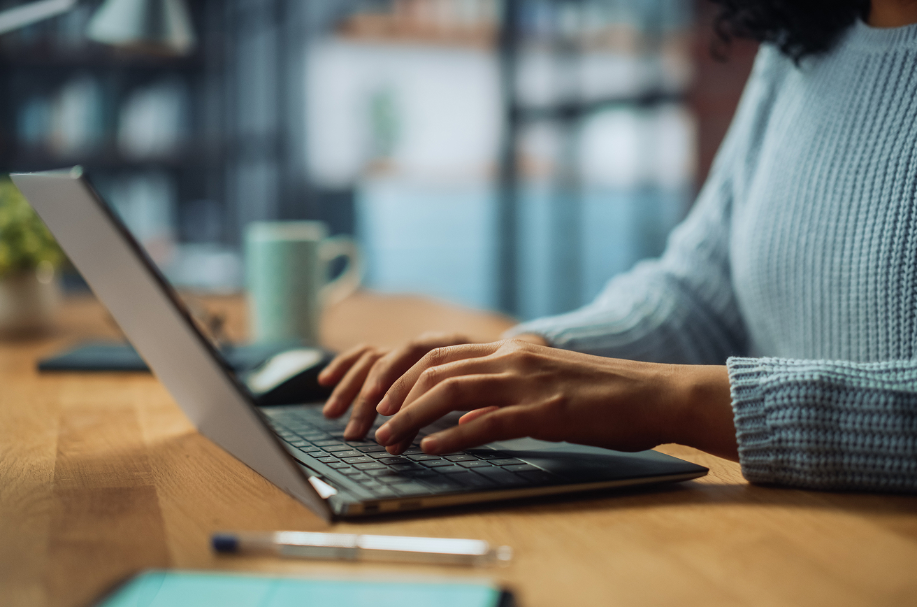 Person typing on laptop