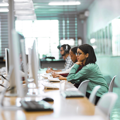 IT team working on desktop computers in an office