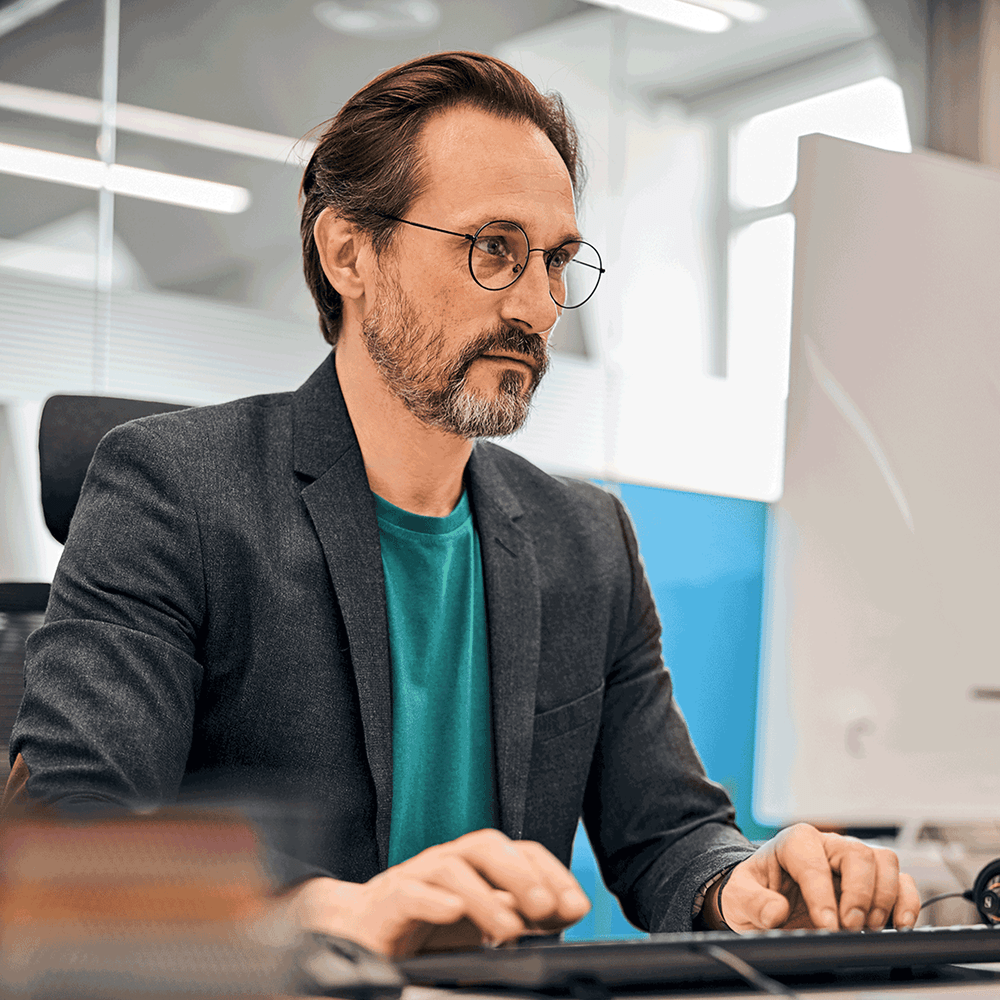 Man reviewing a job board on desktop computer