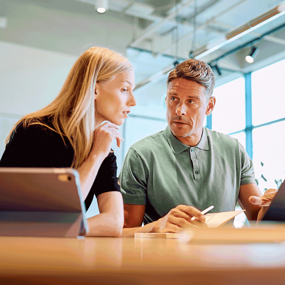 People collaborating on a training document