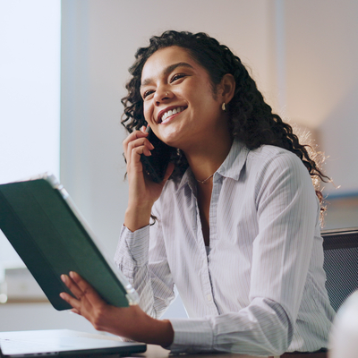 Smiling woman talking on phone