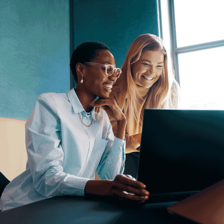 People collaborating on a desktop computer 