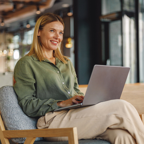 Woman reviewing information on a laptop