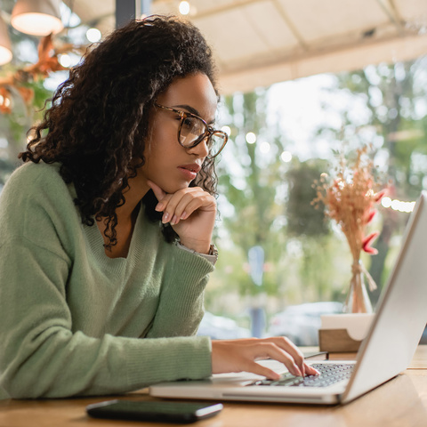 Woman searching on her laptop