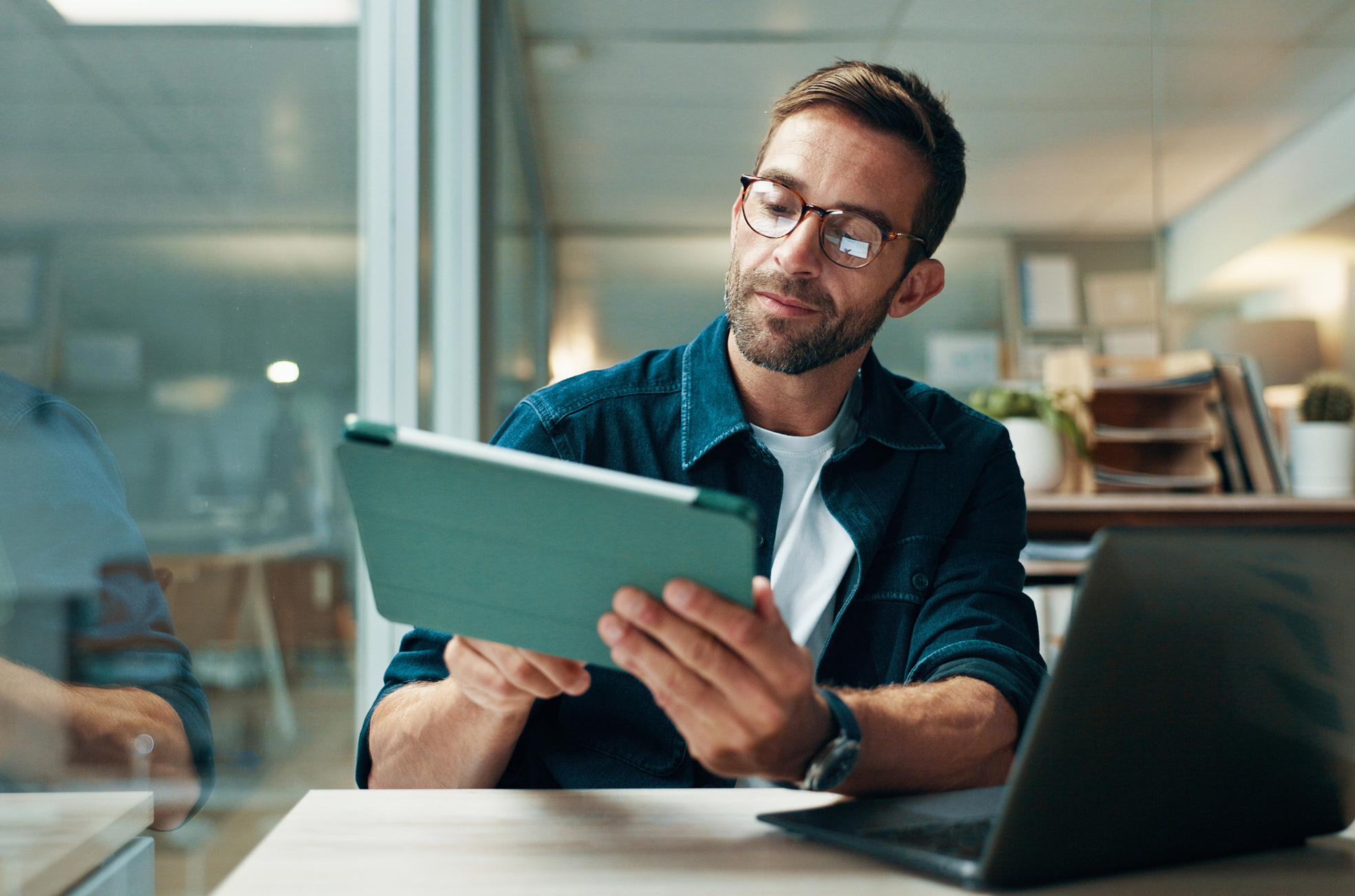 Man using tablet in an office setting