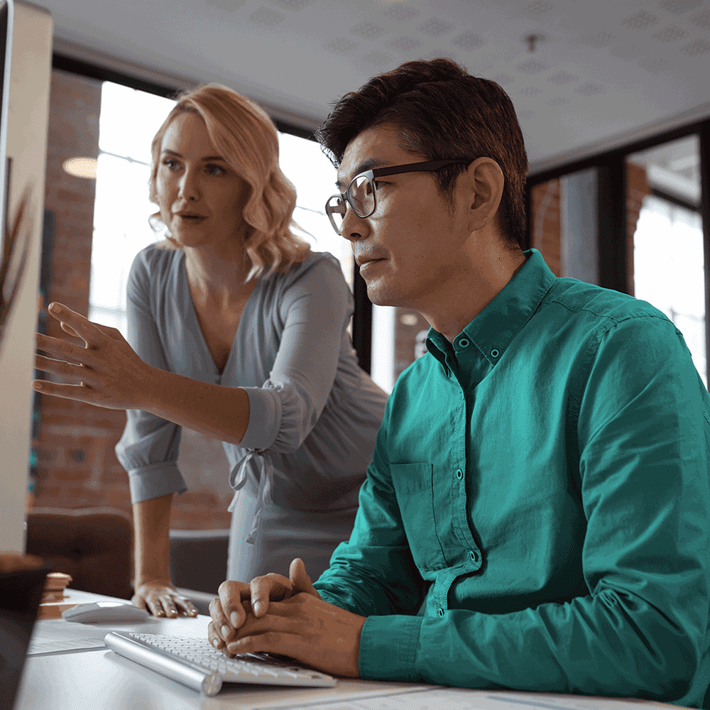 Team reviewing job ads on a computer