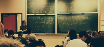 professor teaching in front of a class