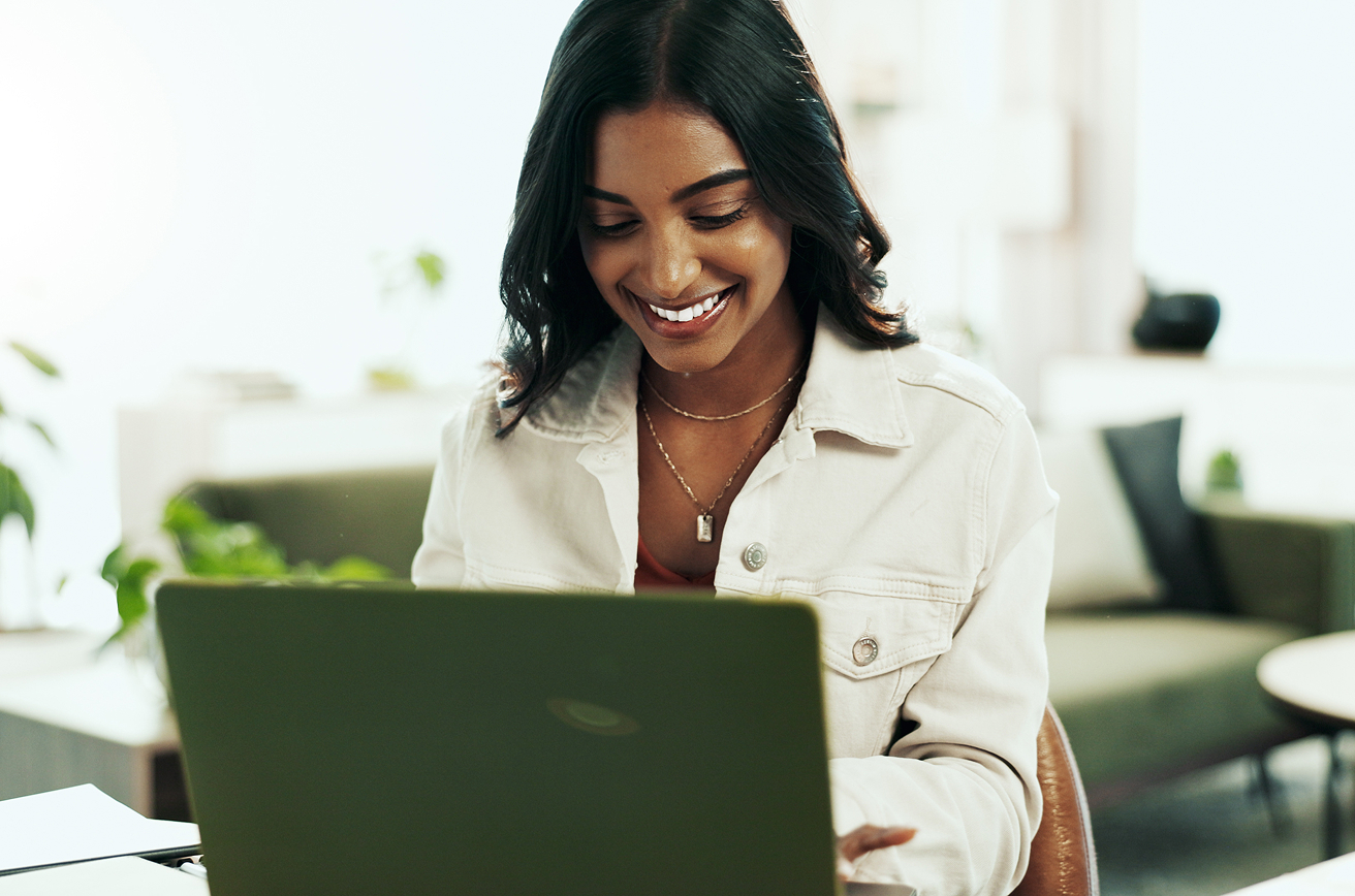 Woman on laptop connecting with community